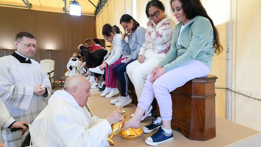 Pope Francis washes the feet of an inmate at the Rebibbia women's prison on the outskirts of Rome as he celebrates the Holy Thursday Mass of the Lord's Supper March 28, 2024. The pontiff washed the feet of 12 inmates at the prison. (CNS photo/Vatican Media)