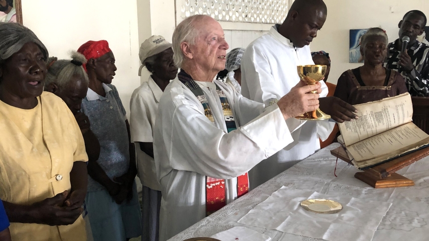 In this undated photo, Father Thomas Hagan, an Oblate of St. Francis de Sales, celebrates Mass in Cité Soleil, Haiti, which is served by the nonprofit ministry he founded called Hands Together. Father Hagan told OSV News April 23, 2024, he was heading back to his longtime ministry in Haiti's besieged capital, after briefly being evacuated for medical treatment. (OSV News photo/Hands Together)