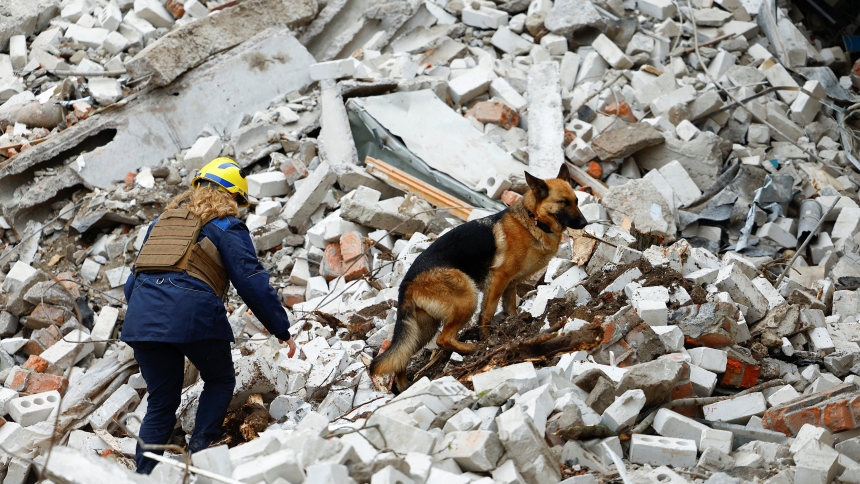 A dog stands on rubble as rescuers work at the site of a  building that was destroyed during a Russian airstrike in Chernihiv, Ukraine, April 17, 2024. (OSV News photo/Valentyn Ogirenko, Reuters)