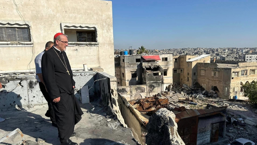 Cardinal Pierbattista Pizzaballa, the Latin patriarch of Jerusalem, walks through the ruins of buildings in Gaza City. He visited northern Gaza Strip May 16-19, 2024, during Pentecost. At a press conference May 20 following his return to Jerusalem, he said he found the small resilient community of the Holy Family Parish compound in Gaza City to have "steadfast faith" amid horrific destruction and constant bombardment. (OSV News photo/courtesy Latin Patriarchate of Jerusalem)