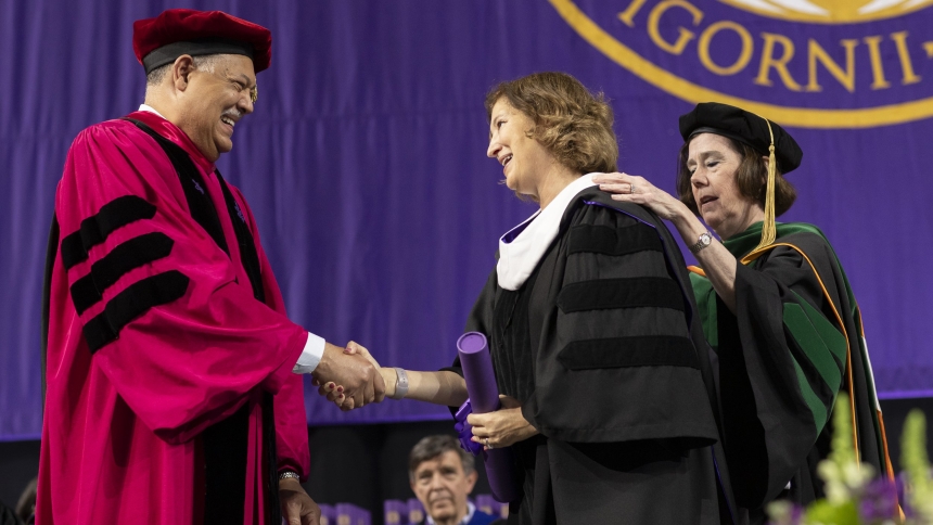 Vincent Rougeau, president of the College of the Holy Cross in Worcester, Mass., presents an honorary doctorate Laurie Leshin, director of NASA's Jet Propulsion Laboratory, after she delivered the commencement address to the class of 2024 May 24, 2024. (OSV News photo/courtesy College of the Holy Cross)