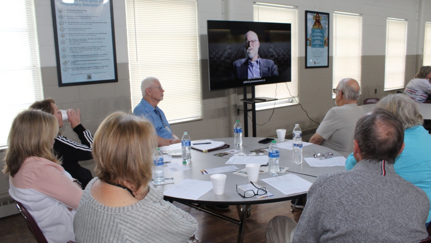 Participants watch the "Am I Saved?" video during the third week of a seven-week Eucharistic Revival discussion series hosted by St. Thomas More in Munster. The series continues at the Weis Center from 9:30-11:30 a.m. Thursdays through June 13 and from 6:30-8:30 p.m. Wednesdays through June 12. (Marlene A. Zloza photo)
