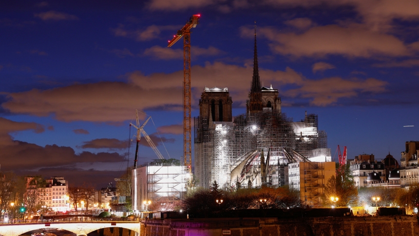 A night view shows the Notre Dame Cathedral in Paris March 30, 2024, with a new spire topped by the rooster and the cross, as restoration works continued following the devastating fire of 2019. (OSV News photo/Gonzalo Fuentes, Reuters)