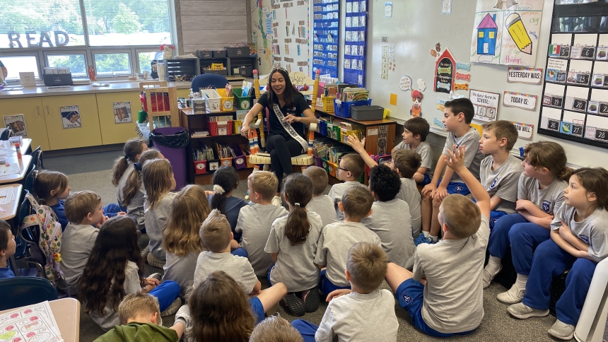 Alana Jardenil, a Valparaiso resident and a sophomore at the University of Notre Dame, interacts with first graders on May 14 at St. Paul Catholic School. During the visit, Jardenil shared details about the Indianapolis 500 car race and how she came to participate in the 500 Festival Princess Program. (Provided photo)