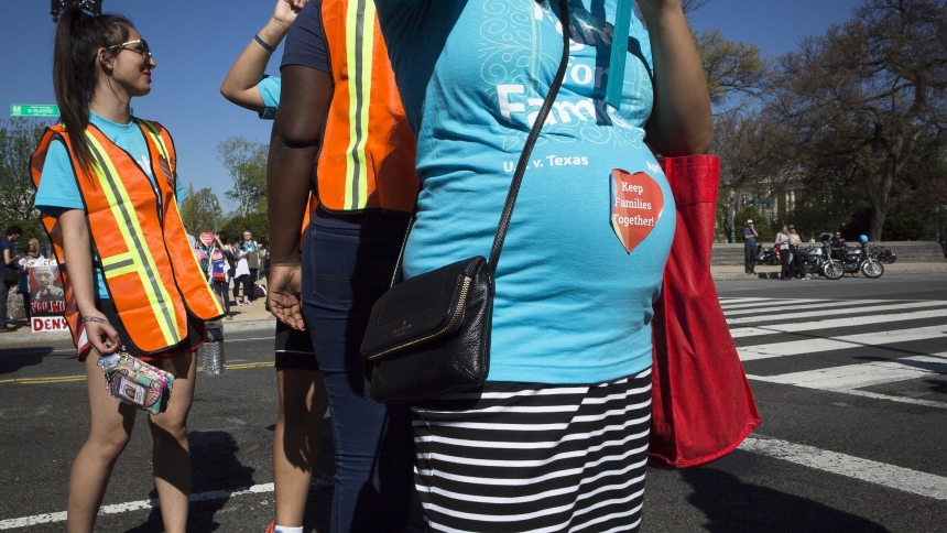 A pregnant woman is seen outside the U.S. Supreme Court in Washington in this 2016 file photo. The U.S. Conference of Catholic Bishops, alongside other Catholic groups, filed suit May 22, 2024, against the Equal Employment Opportunity Commission for including abortion among final regulations for a law meant to add workplace protections for pregnant workers. (OSV News photo/Tyler Orsburn, CNS)