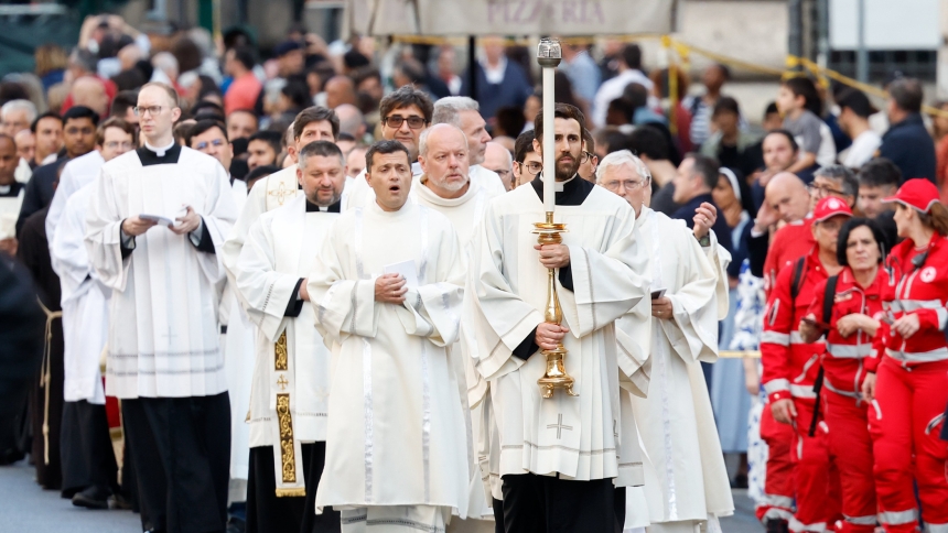 People walk in a Corpus Christi procession to the Basilica of St. Mary Major after Pope Francis’ Mass for the feast of the Body and Blood of Christ in Rome's Basilica of St. John Lateran June 2, 2024. (CNS photo/Lola Gomez)