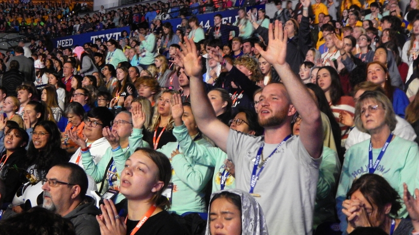 A participant prays during the closing Mass of the National Catholic Youth Conference at Lucas Oil Stadium in Indianapolis Nov. 18, 2023. The National Eucharistic Congress will be held in the stadium July 17–21, 2024. (OSV News photo/Mike Krokos, The Criterion)