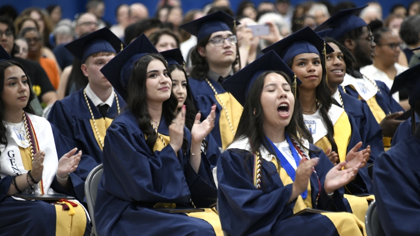 Bishop Noll Institute new graduates cheer for their classmates as they cross the stage in the gymnasium for the 101st commencement exercises in Hammond on June 6. The class of 2024 earned a record amount of college scholarship offers, according BNI administrators. (Anthony D. Alonzo photo)