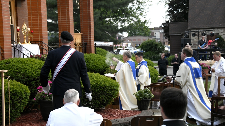 Bishop Robert J. McClory (center) incenses the monstrance during the True Presence: Night of Praise, Worship and Adoration on May 31 outside St. Mary church in Crown Point. The Eucharistic liturgical event was the kick-off to a summer of Eucharistic Revival events locally, which are connected this year's national Catholic movement. (Anthony D. Alonzo photo)