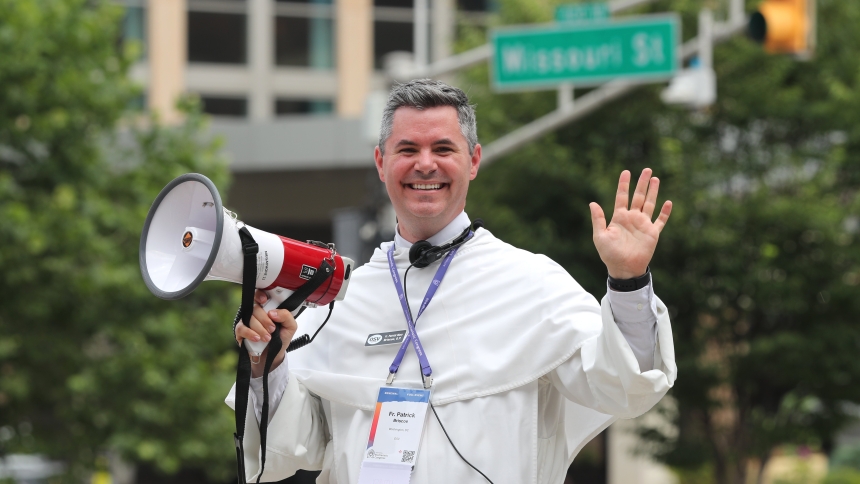 Fr. Patrick Briscoe welcomes pilgrims to the National Eucharistic Congress