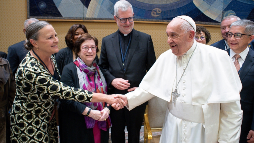 Dr. Amy McCormack, president of Calumet College of St. Joseph in Hammond, is greeted by Pope Francis as she participates in a private audience with him at the Vatican during a recent visit to Italy with the Association of Catholic Colleges and Universities. "It was a once-in-a-lifetime exoerience," said Dr. McCormack, whoconversed with the pointiff about educational issues. (Photo courtesy of Vatican Media)