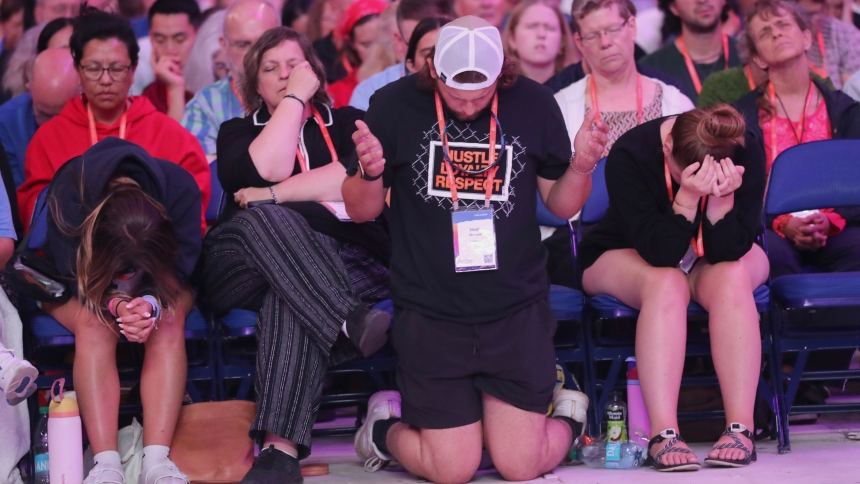 Pilgrims pray during a July 19, 2024, Encounter impact session at Lucas Oil Stadium during the National Eucharistic Congress in Indianapolis. (OSV News photo/Bob Roller)