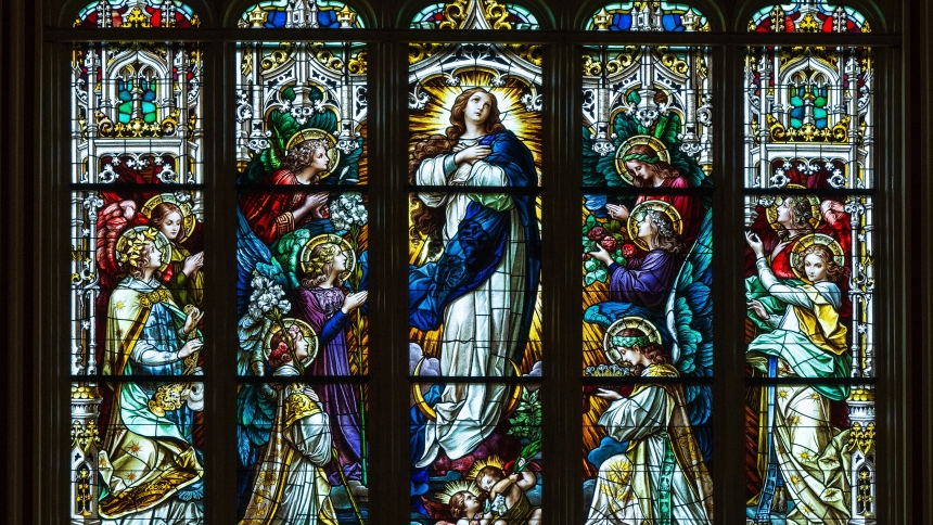 The south wransept Window inside the Cathedral Basilica of St. John the Baptist in Savannah, Ga., depicts the Assumption of the Blessed Virgin Mary. Above, Christ holds a crown for her coronation as Queen of Heaven. The feast of the Assumption of the Blessed Virgin Mary is Aug. 15. (OSV News photo/Sam Lucero)