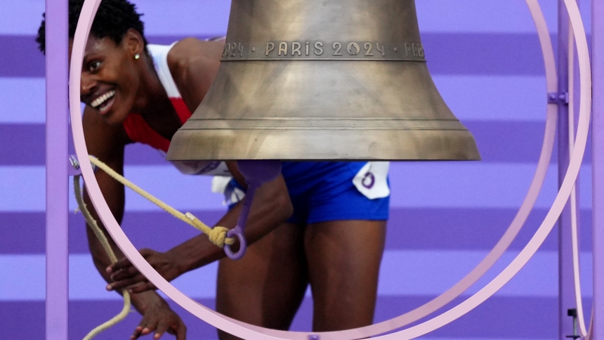 Marileidy Paulino of the Dominican Republic rings the Olympic bell Aug. 10, 2024, as she celebrates after winning gold and setting a new Olympic record in the women's 400-meter final during the 2024 Paris Olympics. The bell, specially cast for the Games by France's Cornille Havard foundry in Normandy, will be placed inside the newly restored Notre Dame Cathedral in Paris during every Mass once the cathedral officially reopens in December. (OSV News photo/Aleksandra Szmigiel, Reuters)