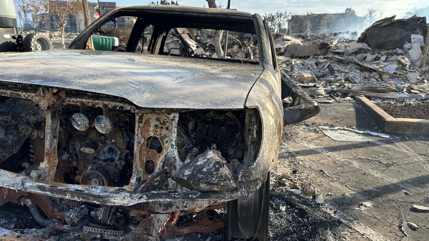 A burned car is seen at the Ho'onanea condominium complex in Lahaina on the Hawaiian island of Maui Aug. 10, 2023. Lahaina's Maria Lanakila Catholic Church was spared from the flames that wiped out most of the surrounding community on Maui Aug. 8 and 9. (OSV News photo/Jorge Garcia, Reuters)