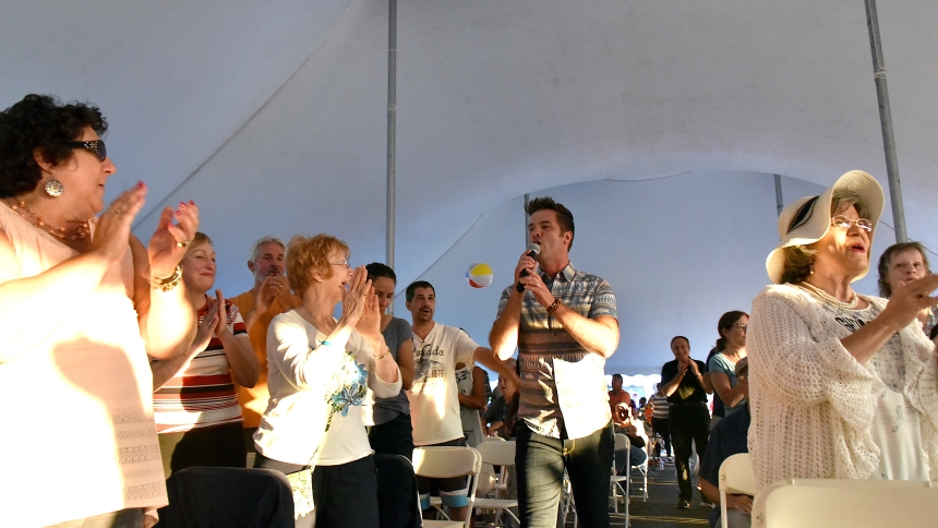 Christian rock recording artist and St. John the Evangelist School and Andrean High School alumnus PJ Anderson walks through the audience gathered under a tent during the Let Your Light Shine concert event at the Shrine of Christ's Passion in St. John on Aug. 3, 2019. Anderson, who is based in Nashville, returns to the Shrine for a concert on Sept. 7 in support of his new album "Heart Healer." (Anthony D. Alonzo photo)