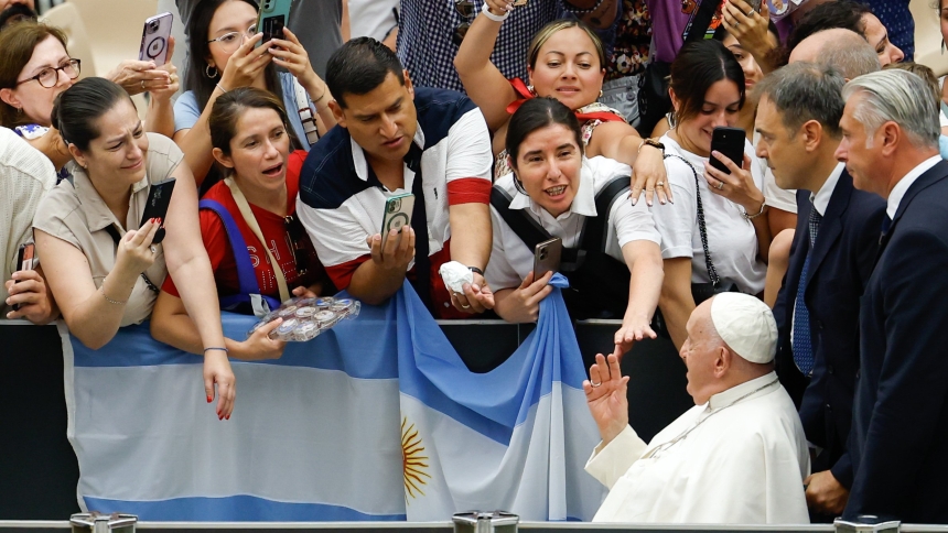 Pope Francis greets visitors at the end of his weekly general audience in the Paul VI Audience Hall at the Vatican Aug. 7, 2024. (CNS photo/Lola Gomez)