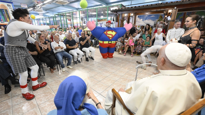 Pope Francis watches a brief performance during a visit to the "Luna Park di Ostia" amusement park in Ostia, Italy, July 31, 2024. He visited the park, which is an hour outside of Rome, to greet workers, their families and the two nuns providing pastoral care there. (CNS photo/Vatican Media)