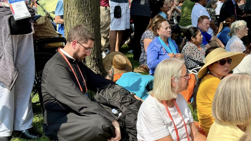 On the park grass at Monument Circle, Indianapolis, Father Robert Ross reflects on the profound reaches of God’s grace during National Eucharistic Congress mid-July.  “He's radiating his grace, and I felt that at the Congress his ‘UV index’ was higher….The Lord is doing something, and He just wants us to witness it, to absorb it and praise Him for it because this is all His work.” (Provided photo)