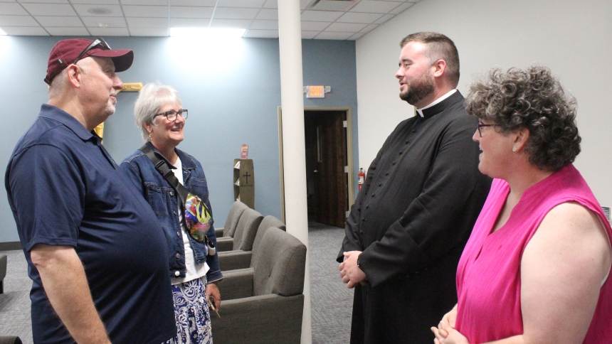 Father Jacob McDaniel talks with (from left) parishioners Greg and Megan Brennecke, of Chesterton,  and Sara Ehlers, of Valparaiso, after the second session of a three-part series, "Return," at St. Teresa of Avila Catholic Student Center in Valparaiso, July 30-Aug. 1. The series focused on how to prepare yourself to evangelize family members, friends and neighbors who have fallen away from the Church, because the faithful must first have a true relationship with God "before you can share it with other peopl