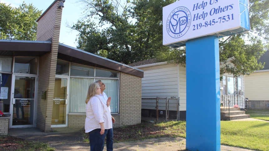 Diane McKern, vice president, and Mike Martinelli, president, take a look at the new sign that identifies the Society of St. Vincent de Paul District Council of Gary headquarters at 2714 169th St. in Hammond. The building has been rented for about a year, and after moving from the former cramped quarters at Our Lady of Perpetual Help in Hammond and settling in, said McKern, the council is ready to have the building formally blessed and host an open house, hopefully later this fall. (Marlene A. Zloza photo)