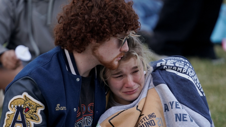 A young woman becomes emotional as she attends a vigil at Jug Tavern Park in Winder, Ga., Sept. 4, 2024, following a shooting that day at Apalachee High School in Winder. A 14-year-old student opened fire at the school killing at least two teachers and two students, authorities said. (OSV News photo/Elijah Nouvelage, Reuters)
