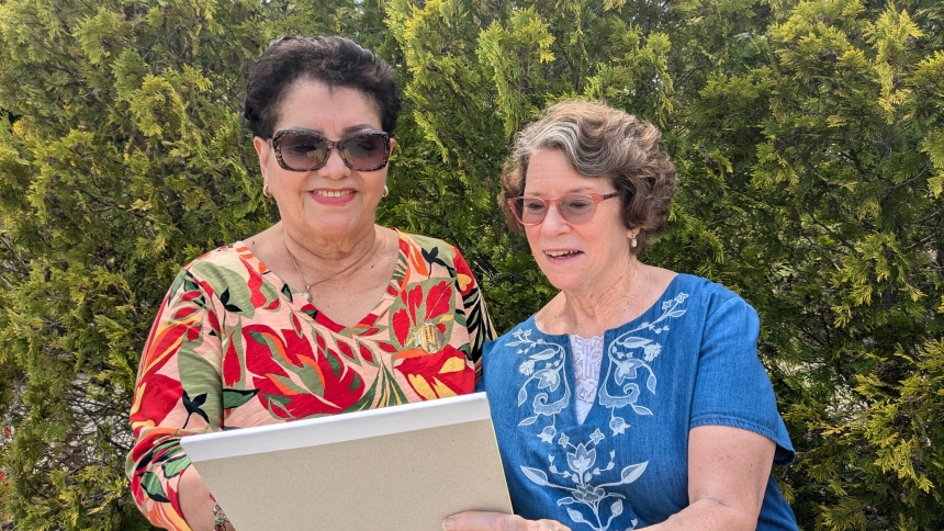 Melba Earnest and Sue Castagna, co-chairs of St. John the Evangelist's Boomers and Beyond, go over some details of their upcoming events while enjoying God's creation outside the parish, 10701 Olcott Ave., St. John, on Aug. 30. The duo encourage seniors from throughout the diocese to attend their upcoming events, especially an Oct. 2 presentation entitled, "How Clean Is Our Clean Water?" (Lynda J. Hemmerling photo)
