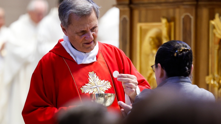 Cardinal Mario Grech, secretary-general of the synod, distributes Communion during Mass with synod participants at the Altar of the Chair in St. Peter’s Basilica at the Vatican Oct. 21, 2024. (CNS photo/Lola Gomez)