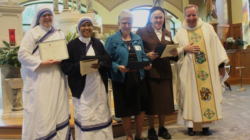 Four religious sisters celebrating milestone jubilees were honored at the annual Eucharistic Liturgy in Thanksgiving for Women Religious, (from left) Sister M. Christa, m.c.; Sister M. Rochelle, m.c.; Sister Pamela Tholkes, PHJC; and Sister M. Janice Kolesiak, OSF; congratulated by Bishop Robert J. McClory. (Marlene A. Zloza photo)