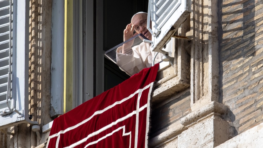 Pope Francis waves to visitors in St. Peter's Square gathered to pray the Angelus at the Vatican Nov. 10, 2024. (CNS photo/Pablo Esparza)