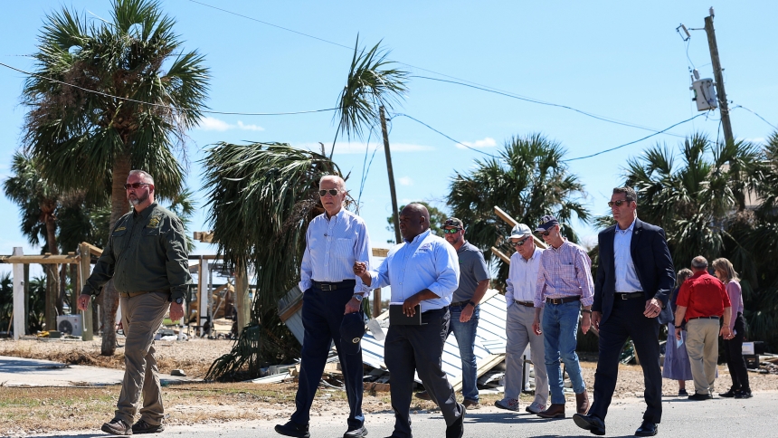 U.S. President Joe Biden speaks with a Federal Emergency Management Agency member Oct. 3, 2024, as he visits storm-damaged areas in Keaton Beach, Fla., in the wake of Hurricane Helene, which made landfall Sept. 26 in the Big Bend region of Florida, near the city of Perry. Helene was followed by Hurricane Milton, one of the strongest hurricanes ever to form in the Gulf of Mexico, Milton made landfall as a major Category 3 hurricane near Siesta Key in Sarasota Oct. 9. (OSV News photo/Tom Brenner, Reuters)  .