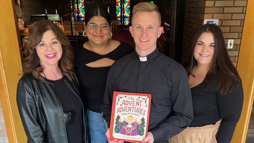 Father Nate Edquist, pastor of Holy Family Parish and vocations director of the Diocese of Gary, holds a recently released book, Advent Adventures with Father Nate, written by parish members and authors Mia Toschi, Saraidee Reyes-Villa, and Madalyn Jozaitis. (Photo provided)