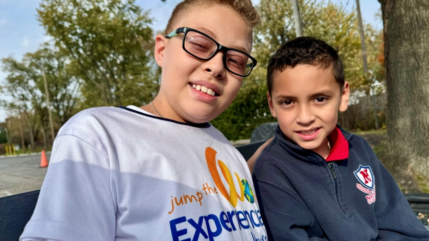 Caption: Guatemalan native Christopher Arrué (left), 10, and Portage resident Joaquin Venegas (right), 9, sit on a park bench during recess on Oct. 30 at Nativity of Our Savior school in Portage. Arrué is one of three youths from Guatemala who are being hosted by Nativity families as the students participate in the Jump the World exchange program, which principal Sally Skowronski said is culturally enriching. (Anthony D. Alonzo photo)
