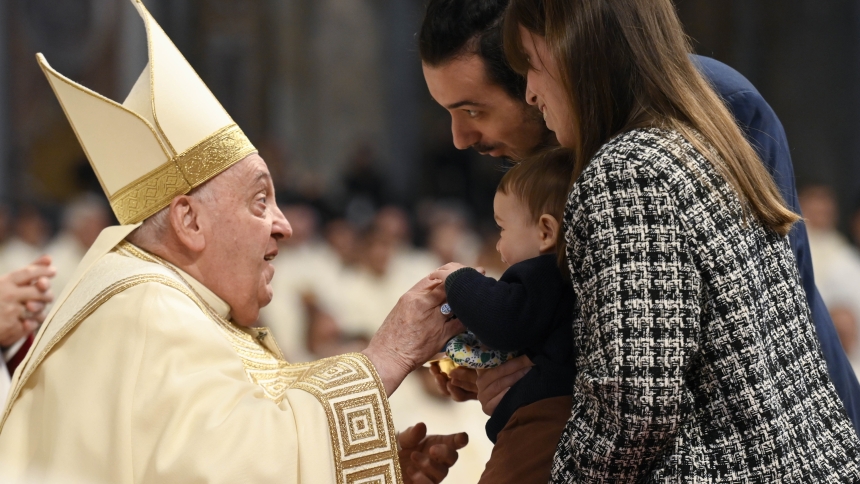 Pope Francis interacts with a child as his parent present the offertory gifts during Mass on the feast of Christ the King and the local celebration of World Youth Day in St. Peter's Basilica at the Vatican Nov. 24, 2024. (CNS photo/Vatican Media)