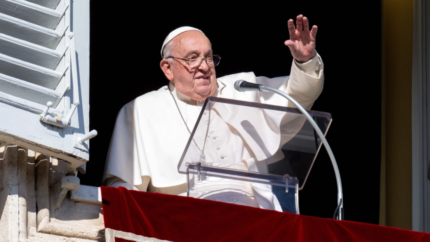 Pope Francis greets people joining him for the recitation of the Angelus prayer in St. Peter's Square at the Vatican Dec. 1, 2024. (CNS photo/Vatican Media)