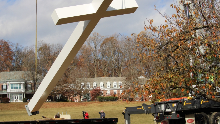 Workers erect a giant cross Nov. 11, 2024, at Malvern Retreat House in Malvern, Pa. The 34-foot-tall was at the center of a Mass celebrated by St. John Paul II Oct. 3, 1979, in Center City Philadelphia. The Mass drew more than a million people. (OSV News photo/Joseph P. Owens, The Dialog)