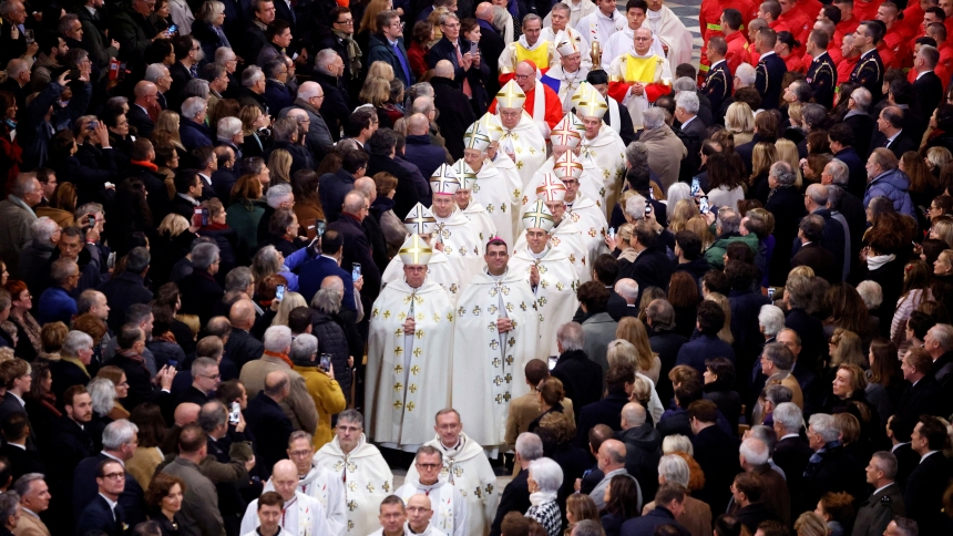 Guests stand as Paris Archbishop Laurent Ulrich, other Catholic bishops and clergy process through the central aisle of Notre Dame Cathedral during a ceremony to mark the landmark cathedral’s reopening following the 2019 fire, in Paris, Dec. 7, 2024. (OSV News photo/Ludovic Marin, pool via Reuters)
