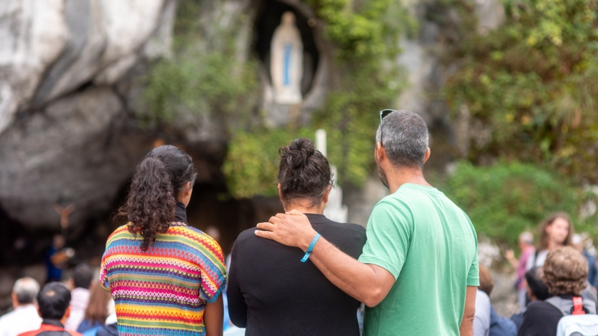 Pilgrims pray in front of the Grotto of the Apparitions in the Sanctuary of Our Lady of Lourdes, France, on Aug. 14, 2024. (OSV News photo/courtesy Lourdes Sanctuary)