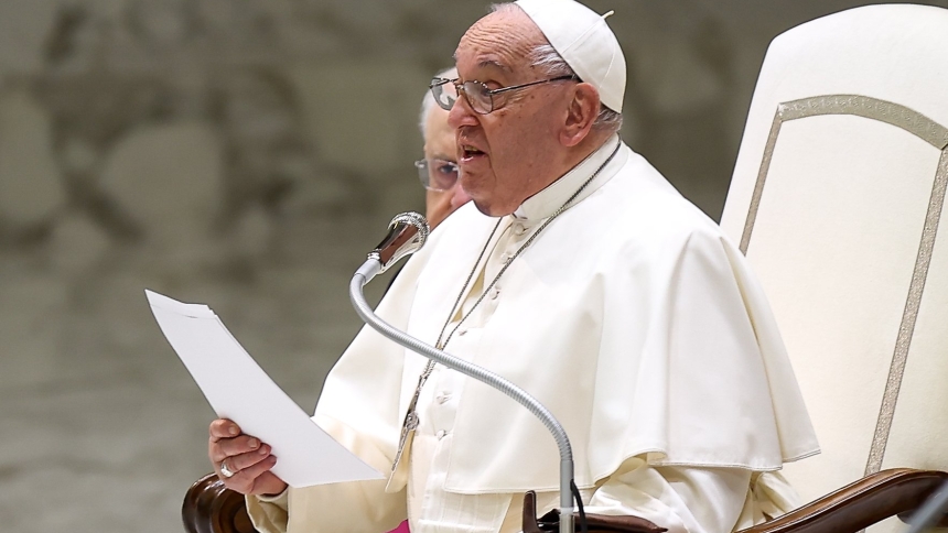Pope Francis talks to visitors during his weekly general audience in the Paul VI Audience Hall at the Vatican Dec. 11, 2024. (CNS photo/Lola Gomez)