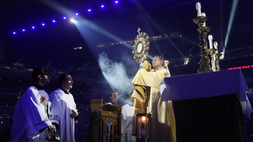 Bishop Andrew H. Cozzens of Crookston, Minn., chairman of the board of the National Eucharistic Congress Inc., blesses pilgrims July 17, 2024, during adoration at the opening revival night of the 10th National Eucharistic Congress at Lucas Oil Stadium in Indianapolis (OSV News photo/Bob Roller)