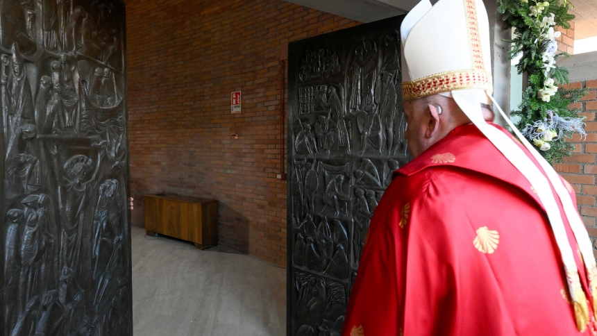 Pope Francis crosses the threshold of the Holy Door of the Church of Our Father at Rome’s Rebibbia prison before presiding over a Mass with inmates, prison staff, and Italian government officials Dec. 26, 2024. (CNS photo/Vatican Media)