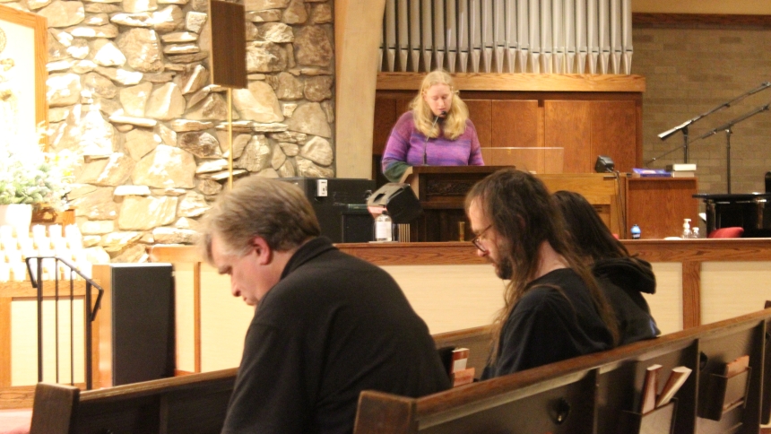 Parishioner Bridget Conry leads a guided meditation on the creche at the birth of Christ during an Advent reflection hosted at Our Lady of Consolation in Merrillvile on Dec. 5. The guest speaker at the first of a three-part series on preparing for Christmas was Deacon Gary Wolfe (left), who spoke on the topic "Joy to the World: the Mystery of the Incarnation." (Marlene A. Zloza photo)