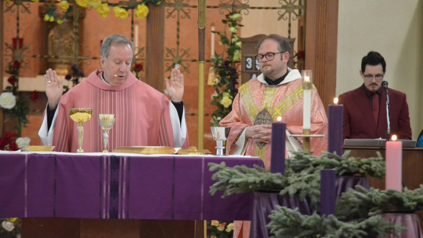 Bishop Robert J. McClory celebrated Mass with Father Jeffrey Burton and the congregation of St. John Bosco in Hammond on Dec. 15. On the third Sunday of Advent, also known as Gaudete Sunday, the bishop shared the message that the faithful can bring their anxieties to the Lord and reminded them to rejoice in God's blessings. (Erin Ciszczon photo)
