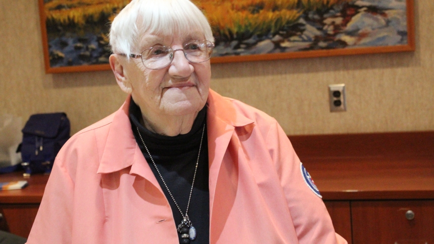 Alice Earnshaw greets visitors to St. Mary Medical Center in Hobart each Tuesday as a volunteer at the West Entrance reception desk. At 94, she enjoys staying activce and helping people. (Marlene A. Zloza photo)
