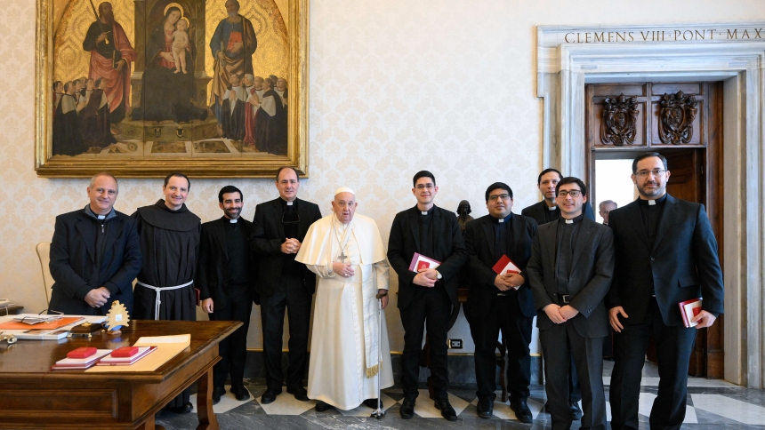 Pope Francis poses for a photo with Argentine priests living in Rome during a meeting at the Vatican Jan. 16, 2025. Earlier in the day, the pope fell and hurt his right arm; while nothing was broken, he is wearing a sling as a "precautionary measure," the Vatican said. (CNS photo/Vatican Media)