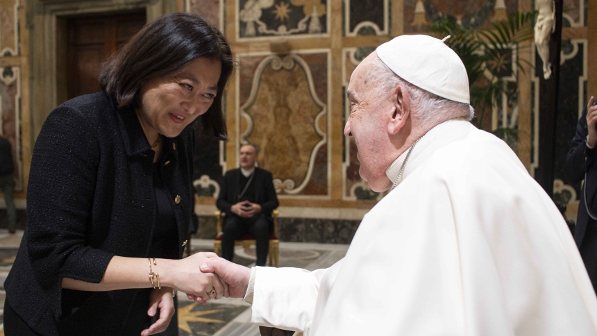 Chieko Noguchi, executive director of public affairs for the U.S. Conference of Catholic Bishops, greets Pope Francis during a meeting with the presidents of bishops' communications committees and the directors of communications for bishops' conferences during a meeting at the Vatican Jan. 27, 2025. (CNS photo/Vatican Media)
