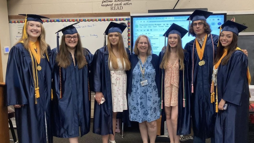 Queen of All Saints teacher Diane Gasaway congratulates a small group of former students including Ashley Sparks, Julia Zerbes, Annaliese Vazquez, Emily Buskirk, Alex Aguirre and Erin Piazzisi following their high school graduation in 2024. (Provided photo)