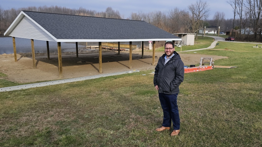 Bill Harmon, Sharing Meadows executive director, stands in front of a new pavilion being constructed near Tucker Lake on the grounds of Sharing Meadows. The pavilion is one of many projects under way for the Sharing Meadows community. (Deacon Bob Wellinski photo)
