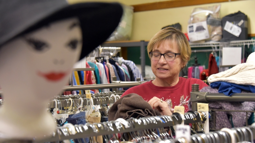 St. Mary’s Thrift Shop manager Mary Davis discovers a sweater among other women’s fashions at the ministry in Michigan City on Jan. 6. The thrift shop, which was founded in 1976, has been housed in three locations, presently on the first floor of the former St. Mary Elementary School, and is known for its wide variety of clothing and household items offered at low prices. (Anthony D. Alonzo photo)
