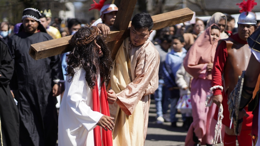 Parishioners participate in a reenactment of the Stations of the Cross at St. John of God Church in Central Islip, N.Y., on Good Friday, April 15, 2022. Most members of the parish trace their ancestral roots to Central America, where the living Way of the Cross is a solemn Holy Week tradition. (OSV News photo/Gregory A. Shemitz)